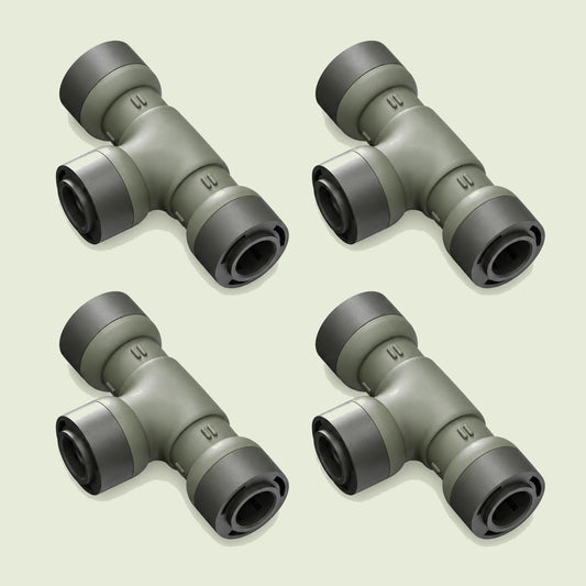 Tee Connector for Irrigation Lines on a soft green background