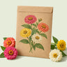 Kraft seed packet illustrated with Thumbelina Zinnia, with fresh Thumbelina Zinnia beside it