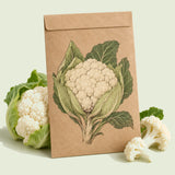 Kraft seed packet illustrated with Twister Cauliflower, with fresh Twister Cauliflower beside it