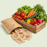 Vegetable Seed Kit, 35 Varieties: open pouch beside a crate of harvested vegetables