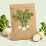 Kraft seed packet illustrated with White Lady Salad Turnip, with fresh White Lady Salad Turnip beside it